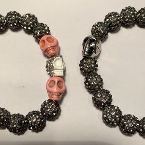 Two Handmade bling skull bracelets.Black and pink